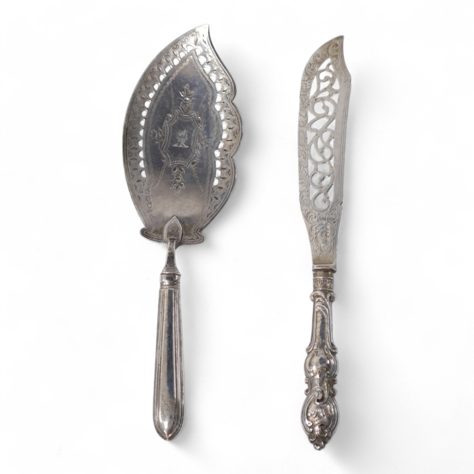 A George III Irish silver fish slice, Joseph Jackson, Dublin, 1801, 30.5cm and a smaller Victorian silver fish slice. Condition - poor to fair